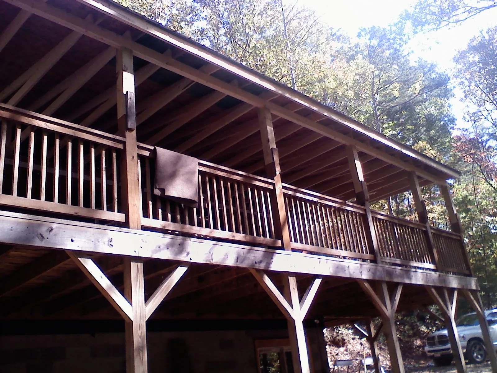 Timber framing under a new elevated porch and deck — Roof Leak Repair in Genoa by Roofing Brothers
